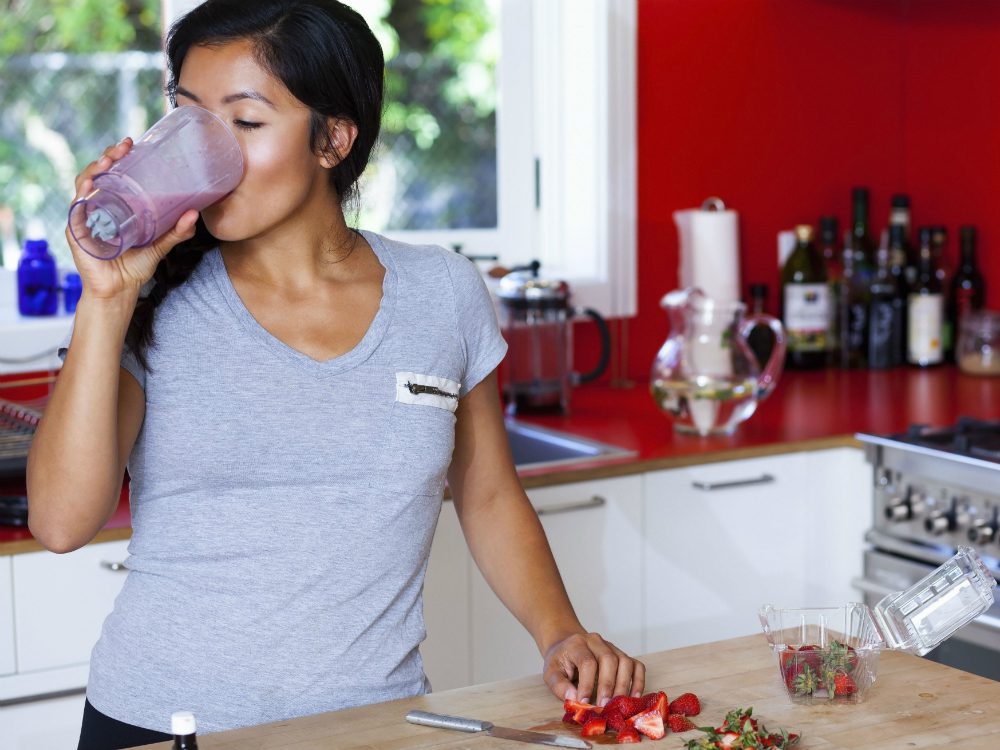 Woman drinking protein shake