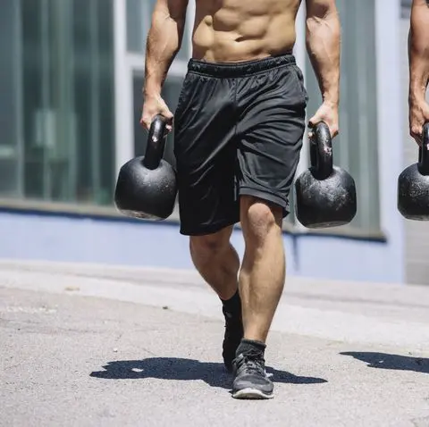 Farmers carry kettle bell