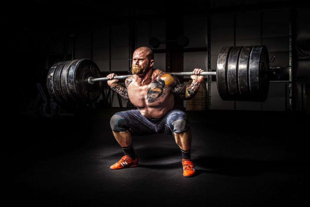 Man back squatting heavy weight