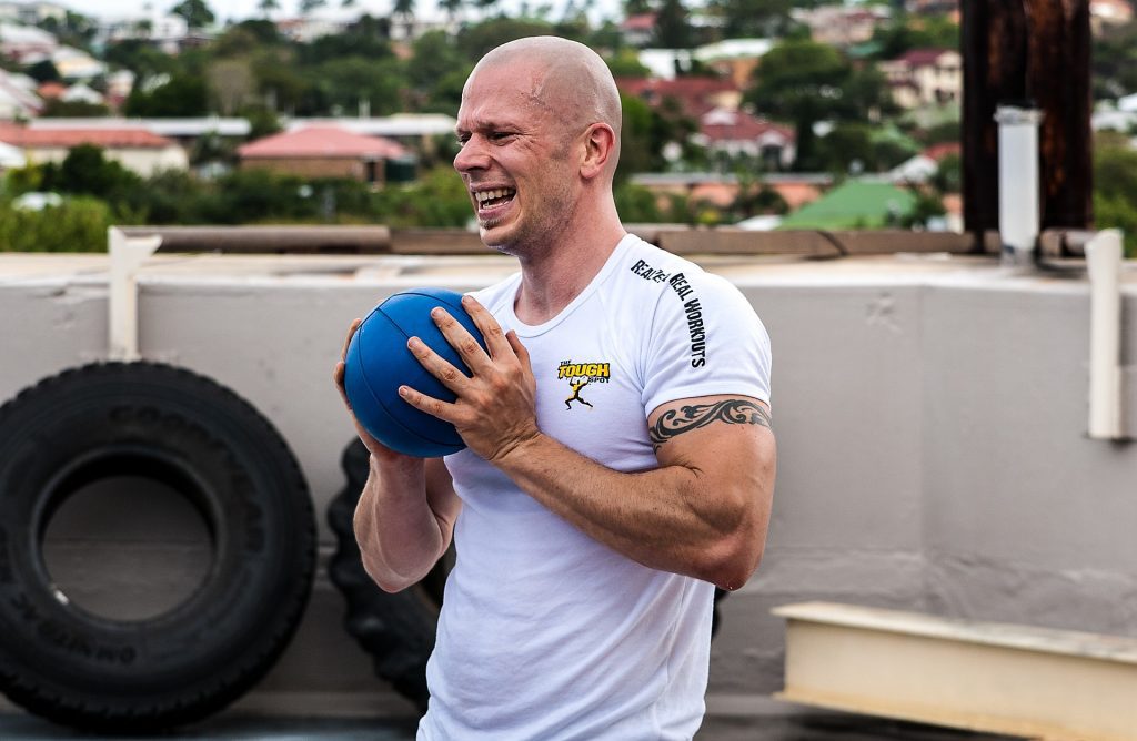 Guy sweating holding ball