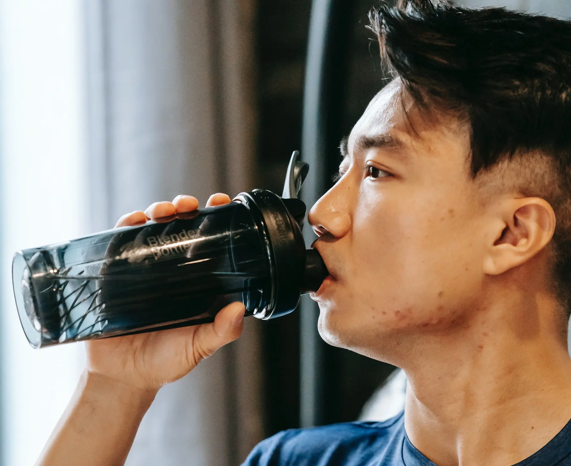 Man drinking pre-workout