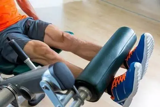 Man performing one of the sissy squat alternatives,Leg extension