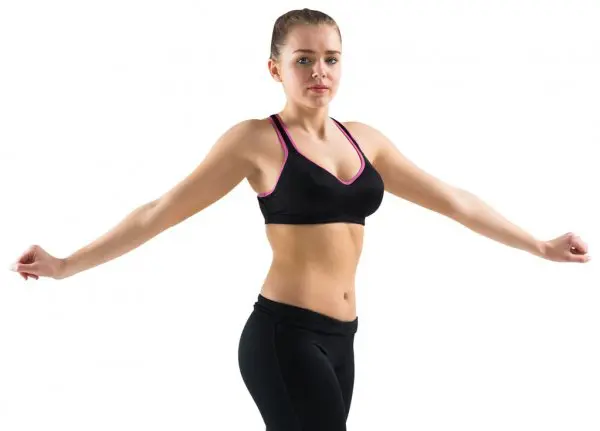 woman performing standing oblique twist