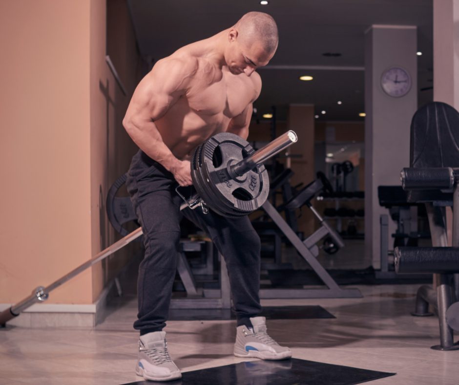 Man performing T-Bar Row for horizontal pulling exercises