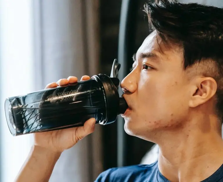 Man drinking pre-workout