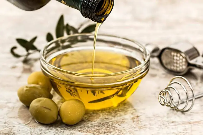 Pouring olive oil into a bowl