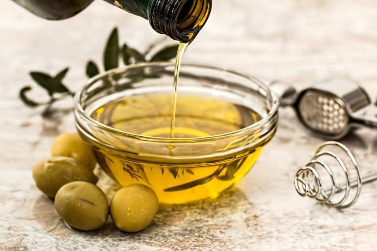 Pouring olive oil into a bowl