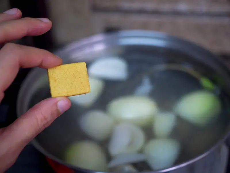 About to put bouillon cube in soup