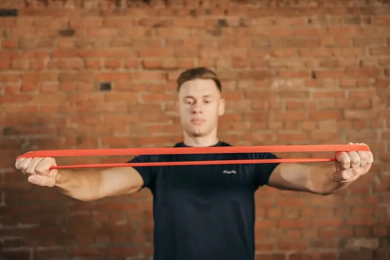 Man pulling a resistance band