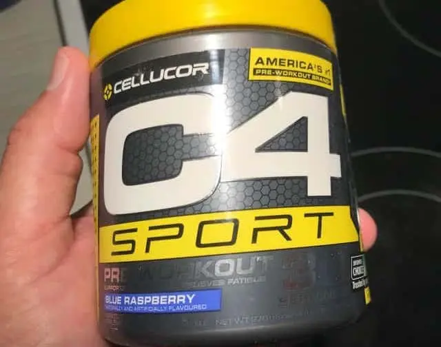 Person's hand holding C4 pre workout