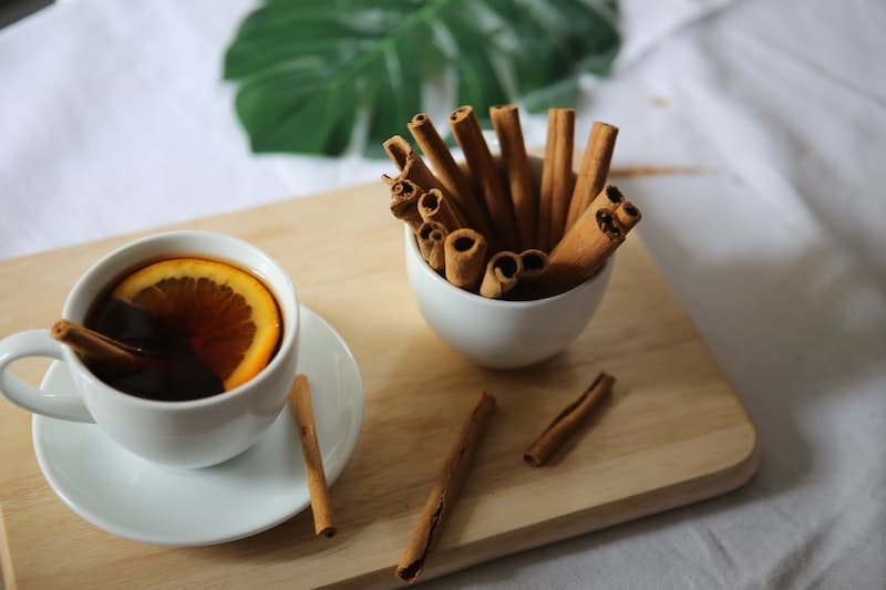 Cinnamon tea on a wooden board