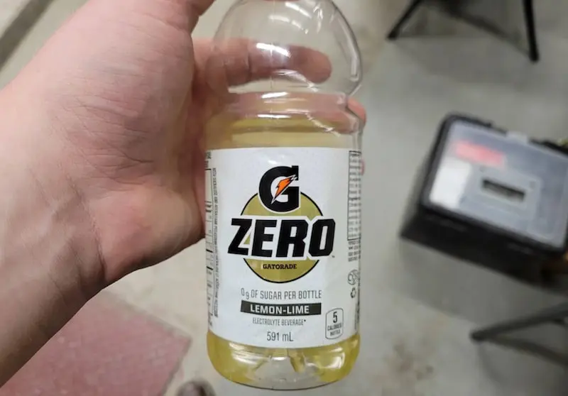 Hand holding gatorade zero bottle