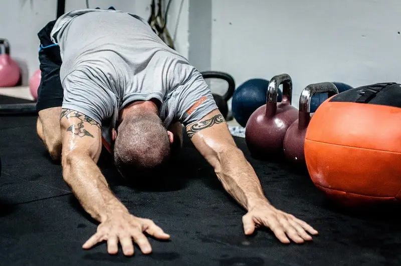 Man doing the cat stretch