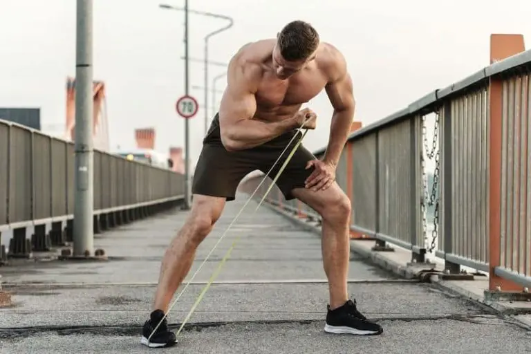 Man doing resistance band bicep curls