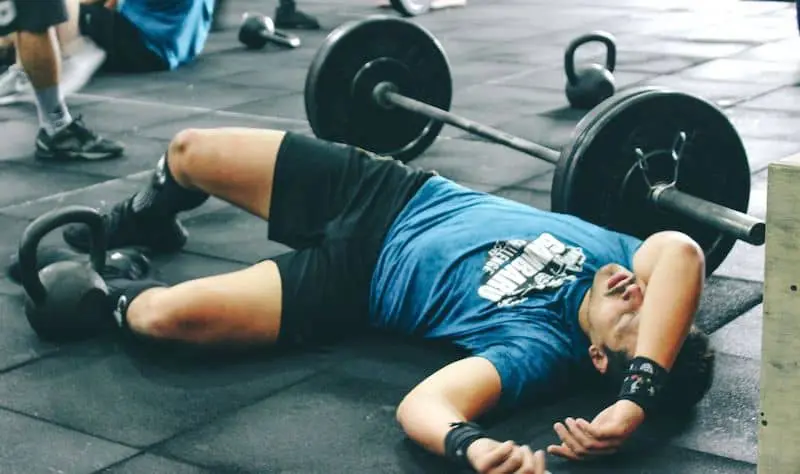 Exhausted athlete lying on the ground