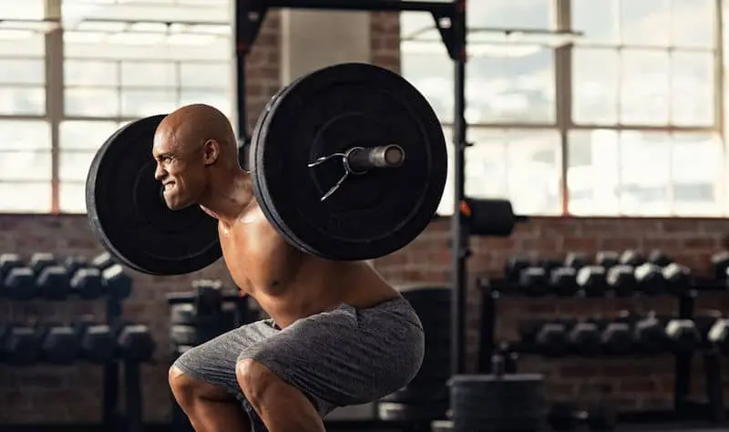 Man doing back squat