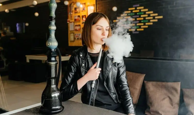 Woman smoking hookah