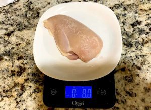 8oz chicken breast on a scale