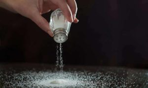 Pouring salt from shaker