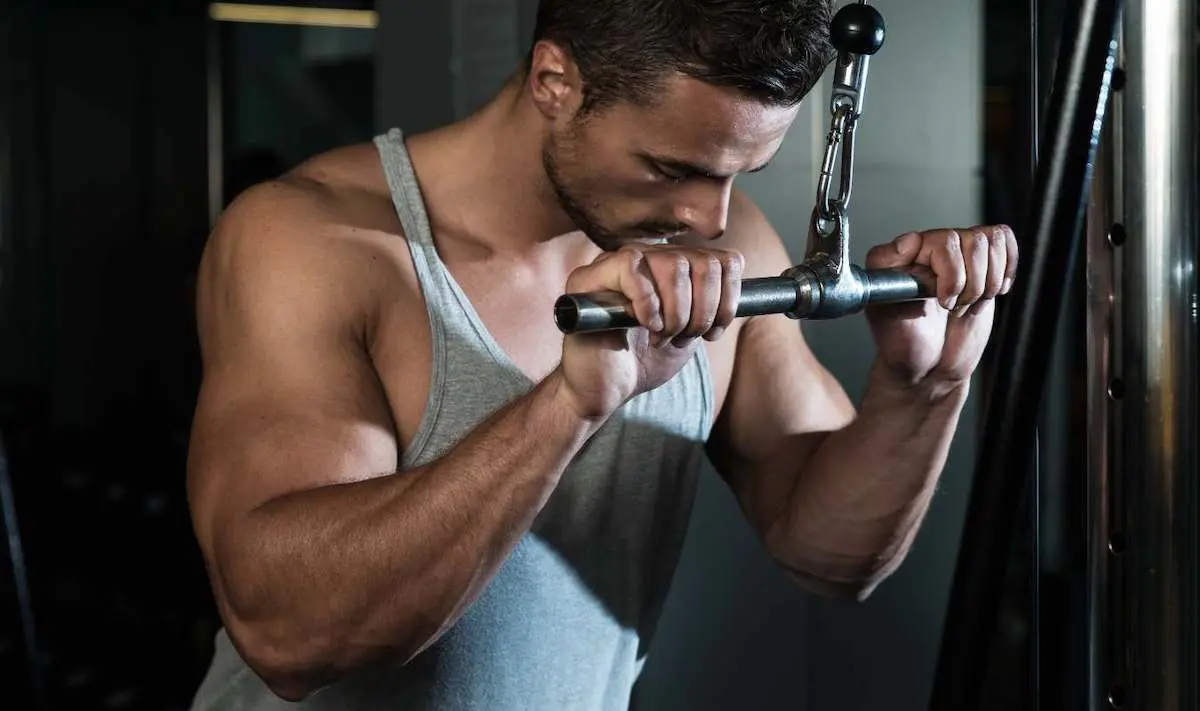 Guy doing tricep push downs