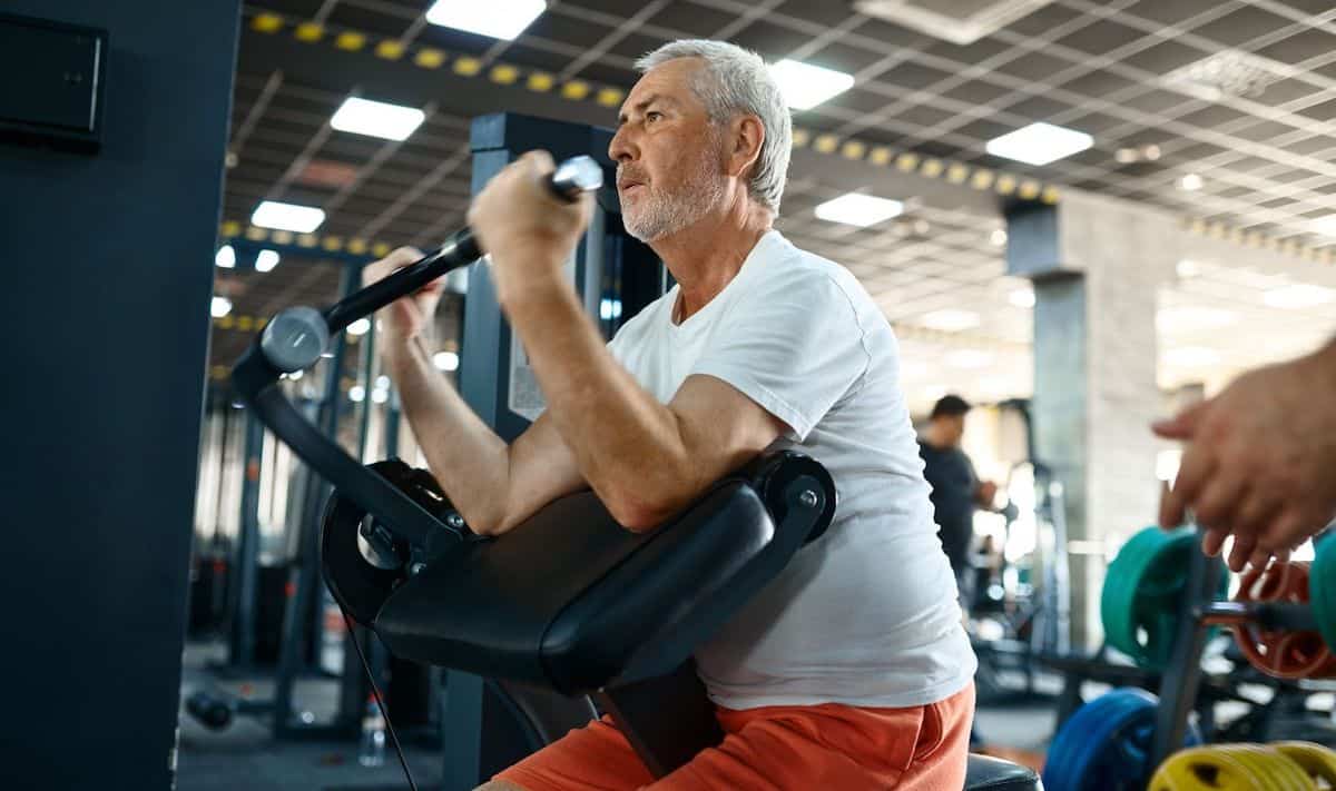 Man over 50 doing preacher curls