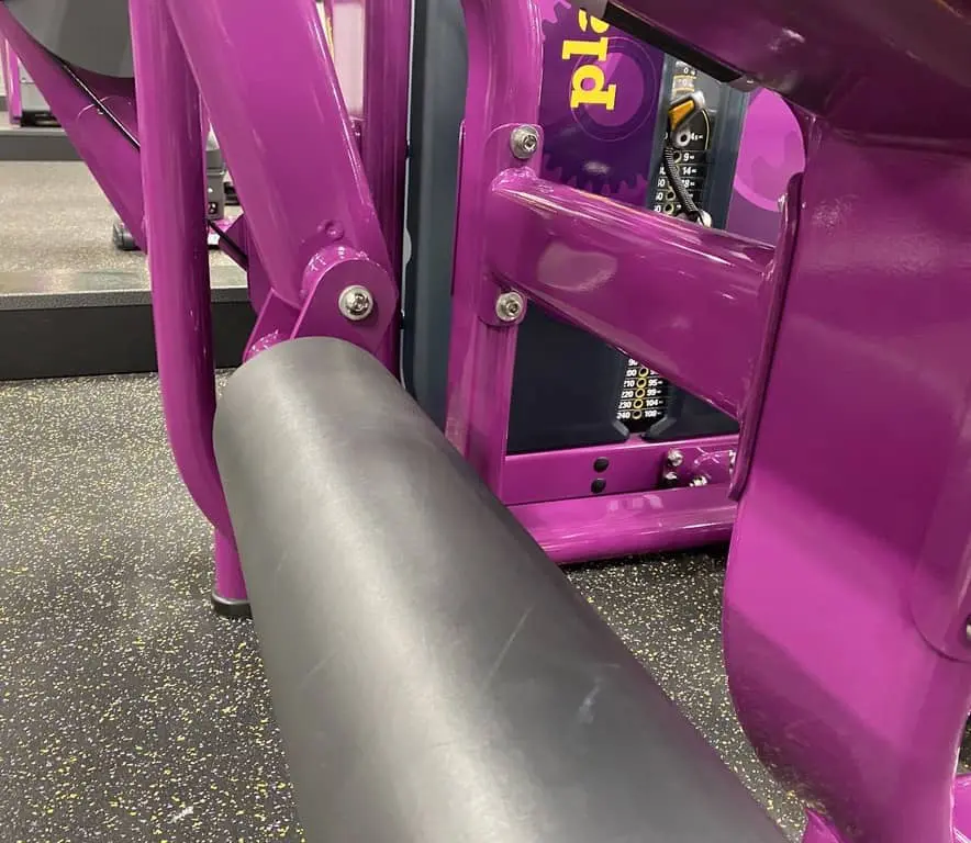 Planet fitness matrix leg machine articulating shin pads