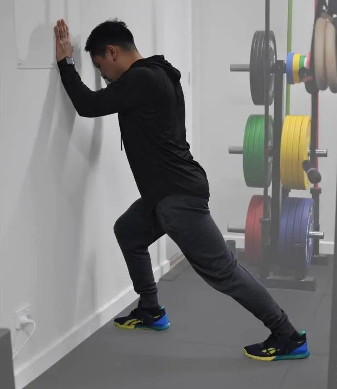 Full body stretching routine - wall calf stretch