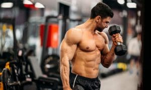Guy with abs doing hammer curl